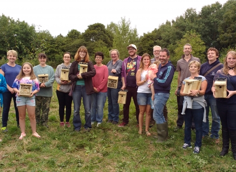 A group posing with the bird & bug boxes they have made copyright Montgomeryshire Wildlife Trust