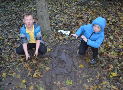 Children having fun in the mud copyright Montgomeryshire Wildlife Trust