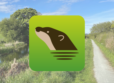 App logo overlaid on picture of the Montgomery Canal