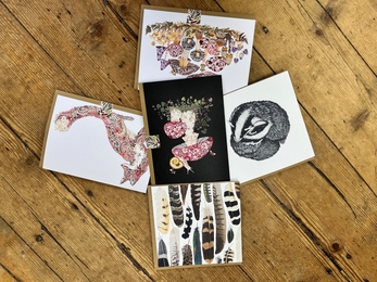 Close up of nature-inspired cards on sale in our shop
