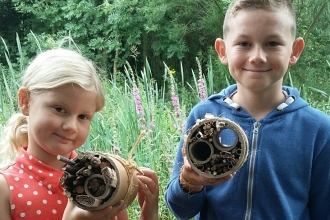 Children making bug homes