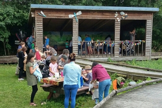 People enjoying an event at Severn Farm Pond copyright Montgomeryshire Wildlife Trust