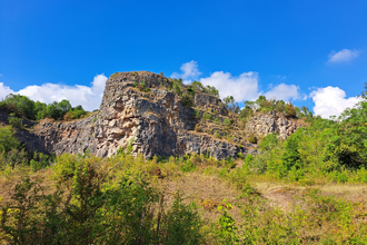 Shot of the cliffs at Llanymyneck Rocks Nature Reserve, with a blue sky