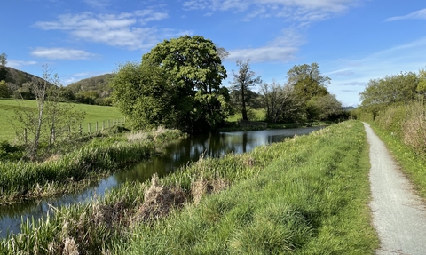 Beautiful spring scene over the Montgomery Canal with the towpath running down the right hand side