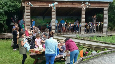 People enjoying an event at Severn Farm Pond copyright Montgomeryshire Wildlife Trust