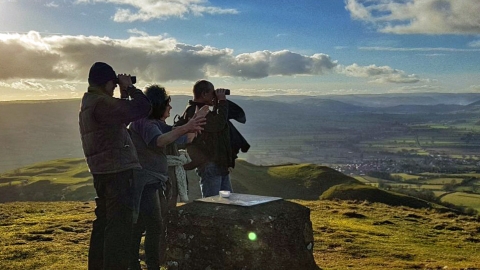 People enjoying the view from Roundton Hill summit copyright MWT