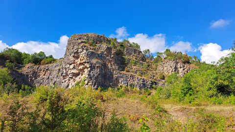 Shot of the cliffs at Llanymyneck Rocks Nature Reserve, with a blue sky