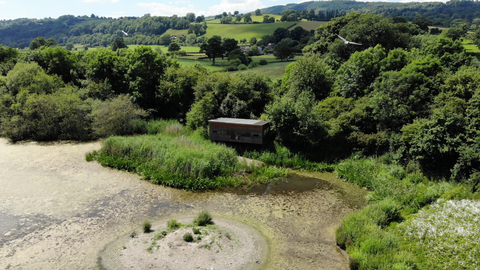 Aerial shot of Llyn Coed y Dinas Nature Reserve and its bird hide