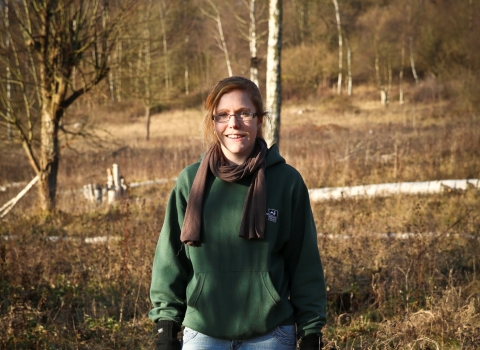 Elaine stands on a nature reserve