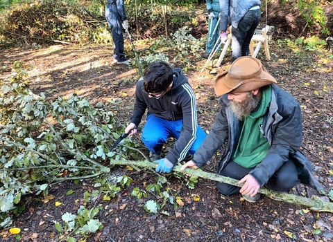 One of the young Wild Skills Wild Spaces participants learns how to safely coppice trees at Severn Farm Pond Nature Reserve copyright Montgomeryshire Wildlife Trust