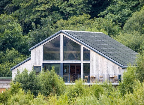The rear side of Dyfi Wildlife Centre, showing the solar array on its south-facing roof