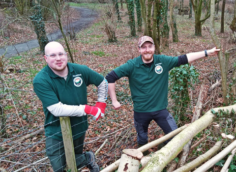Two volunteers from the Friends of Severn Farm Pond group