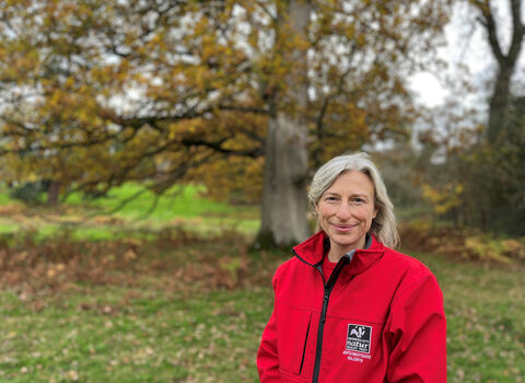 Alison Alexander, close up in front of a tree